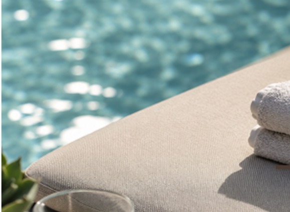 Pool Image a lounge chair beside a pool